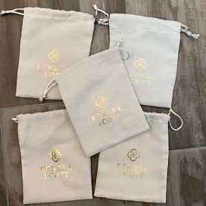 Five Kendra Scott jewelry bags